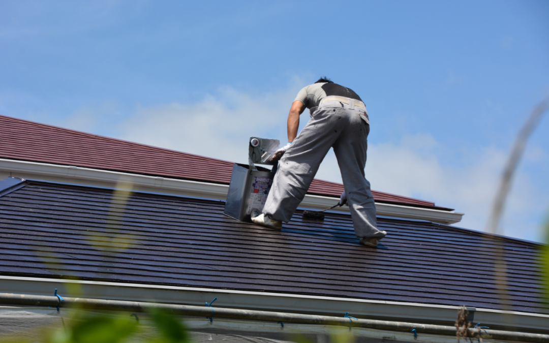 A painter painting a roof